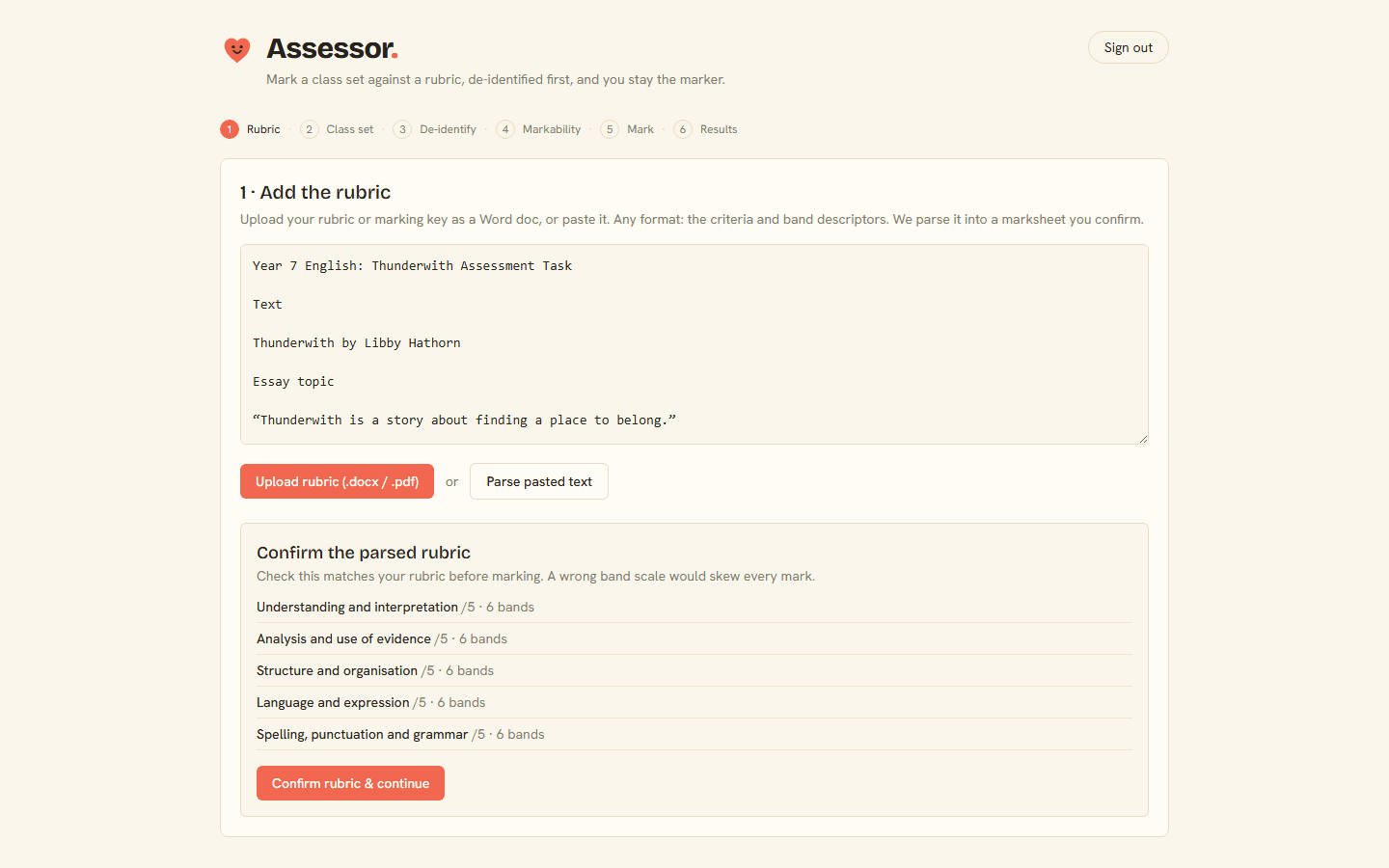 Assessor parsing a rubric into per-criterion band scales you confirm before marking.